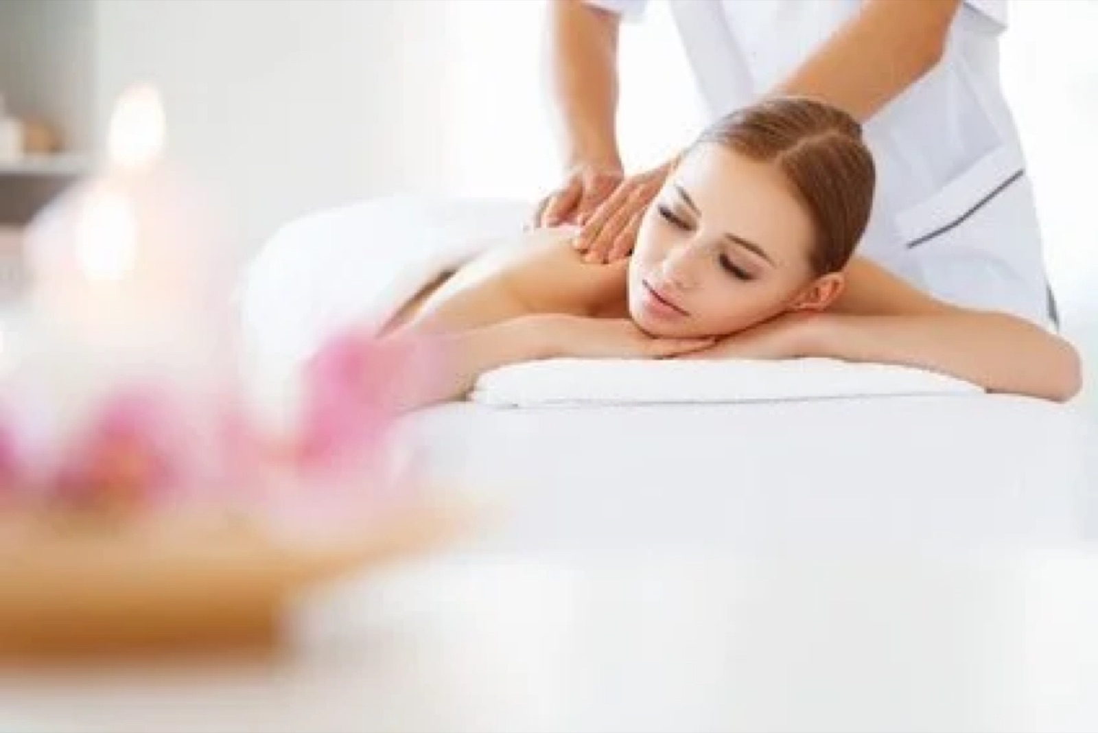 Woman receiving a massage while lying on her stomach.